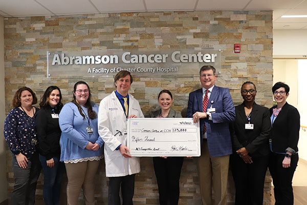 Chester County Hospital President and CEO Michael Duncan presents a check for $15,000 from the American Cancer Society to staff from The Abramson Cancer Center at Chester County Hospital.